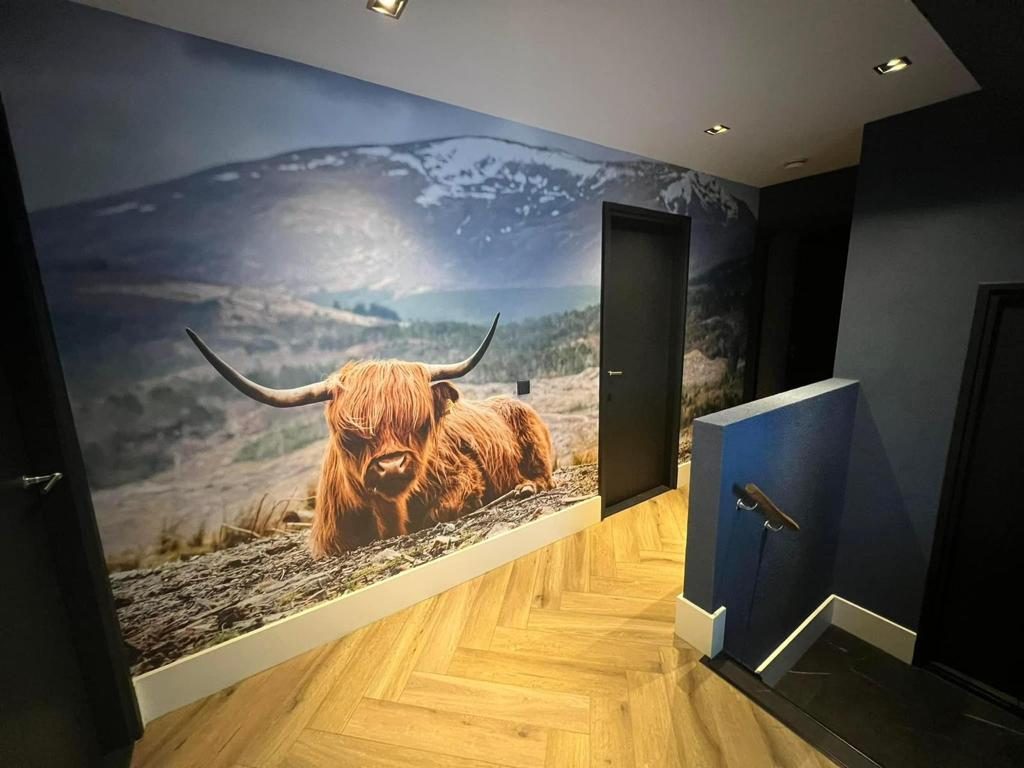 Woonkamer met wandprint — Apeldoorn